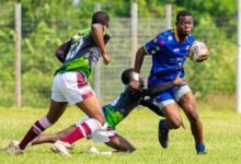 • Tigers Anthony Awuku charges away from his markers during the game