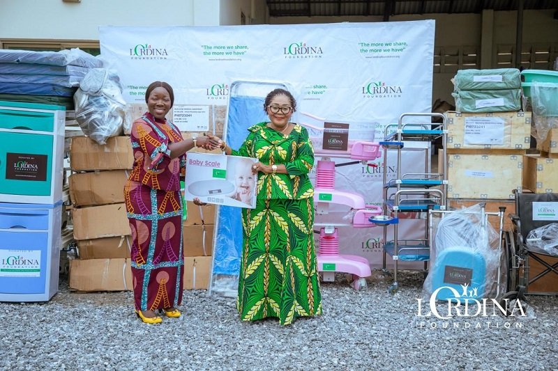 • Mrs Mahama (right) presenting the items to Mrs Ofosu-Agyare
