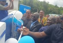 Mr Eric Ayaba (middle) inaugurating the facility and supported by the Headmaster of the school Mr Buaman and other dignitaries