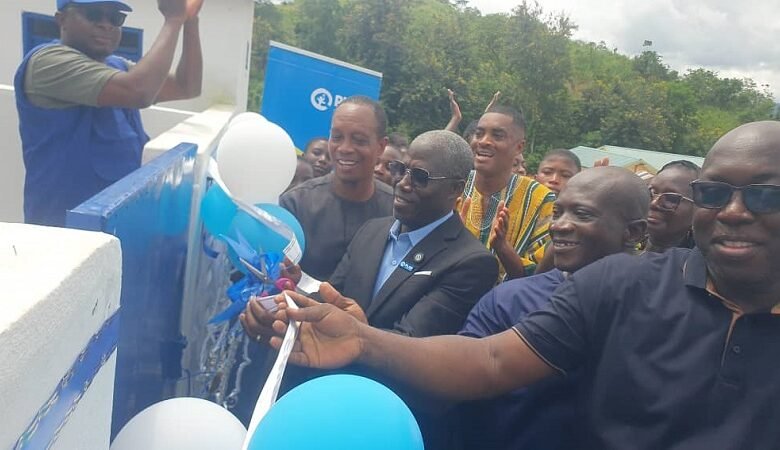 Mr Eric Ayaba (middle) inaugurating the facility and supported by the Headmaster of the school Mr Buaman and other dignitaries