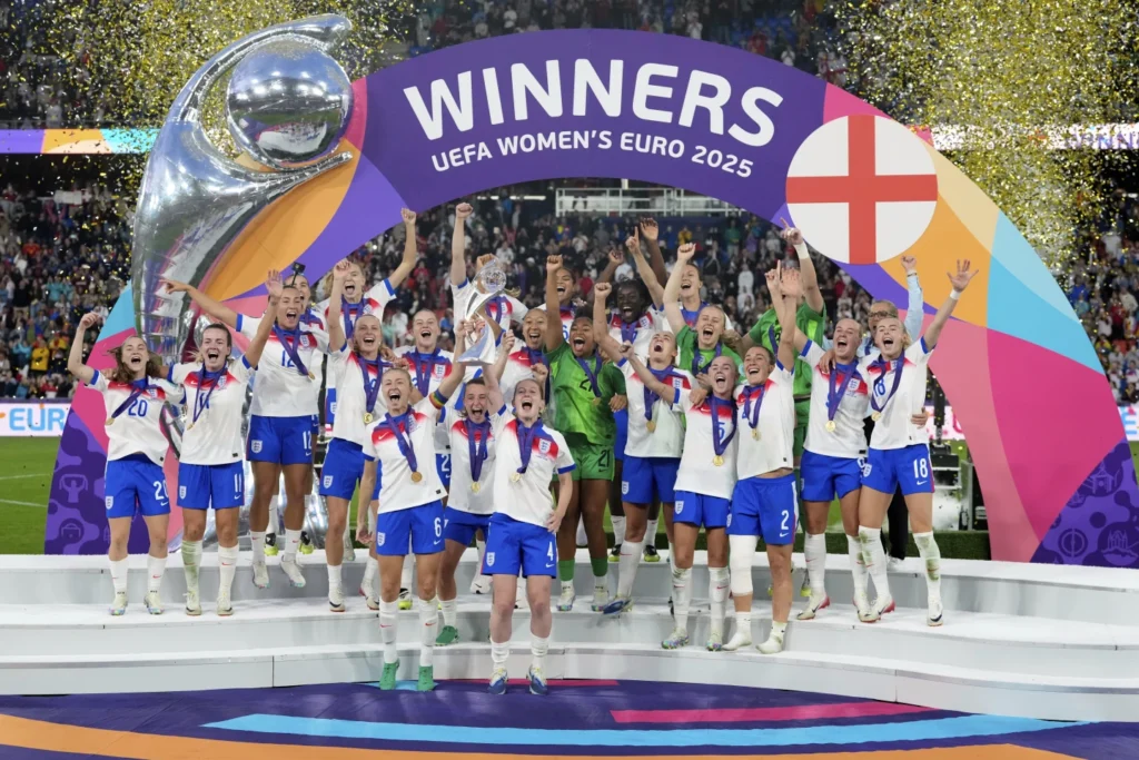 • England players celebrate with the Euro 2025 trophy