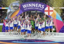 • England players celebrate with the Euro 2025 trophy
