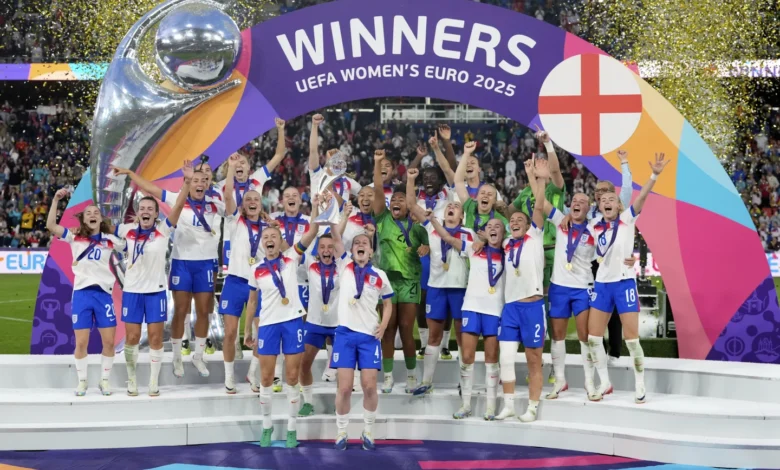 • England players celebrate with the Euro 2025 trophy