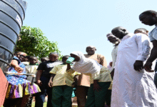 • Inset: A child drinking from the water facility