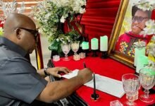 Dr Victor Asare Bampoe signing the book of condolence