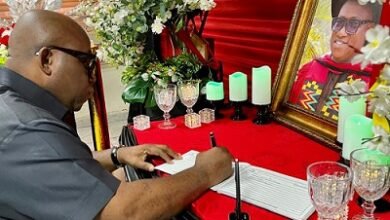 Dr Victor Asare Bampoe signing the book of condolence