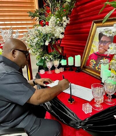 Dr Victor Asare Bampoe signing the book of condolence