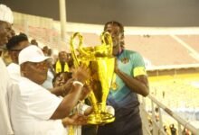 • Gbese Mantse, Nii (Dr) Ayibonte II (left) presenting the trophy to Hearts of Oak captain Benjamin Asare