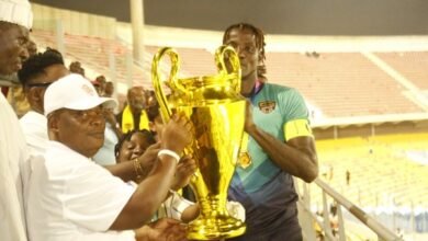 • Gbese Mantse, Nii (Dr) Ayibonte II (left) presenting the trophy to Hearts of Oak captain Benjamin Asare