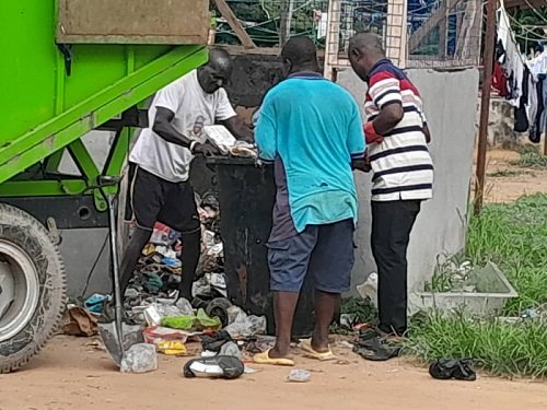 • The Assemblyman (right) and others clearing waste at Korle-Bu