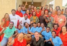 Mr Sotou, Deputy Head of Brazilian Mission in Ghana (seated in black) with Ação Zumbi collective