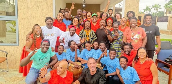 Mr Sotou, Deputy Head of Brazilian Mission in Ghana (seated in black) with Ação Zumbi collective