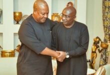 • President John Mahama (right) being consoled by President Julius Maada Bio