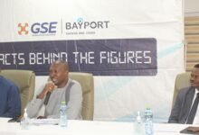 • Mr Akwasi Aboagye (middle) MD, Bay Port Savings and Loans PLC addressing the press.