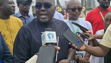 • Mr Debrah speaking at the programme. With him is Mr Mubarak (second from right)