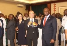 • Mr Tong Defa, Chinese Ambassador to Ghana (middle) proposing a toast with Dr Edward Omane Boamah at the anniversary. Photo: Ebo Gorman