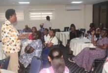 • Mrs Susan Aryeetey (standing) speaking to participants at the meeting. Photo: Seth Osabukle