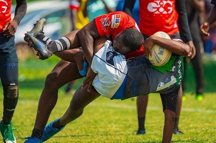 • Desmond Geotrah of Bulls tries to take the ball away from a Dragon's player