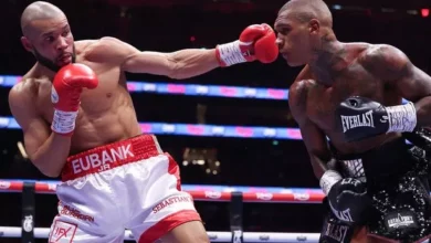 • Eubank Jr (left) in a previous bout with Benn