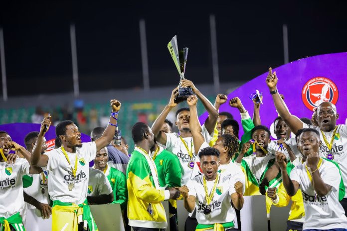 • Gold Stars players celebrating with the trophy