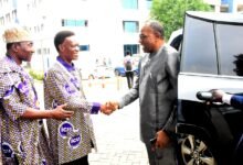 Mr Morgan Ayawine (middle) welcoming Dr Rashid Pelpuo to the conference Photo Seth Osabukle