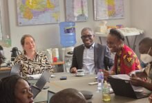 Ms Janine Walz and Dr Gameli Kewuribe Hoedoafia (middle) with other dignitaries in the meeting