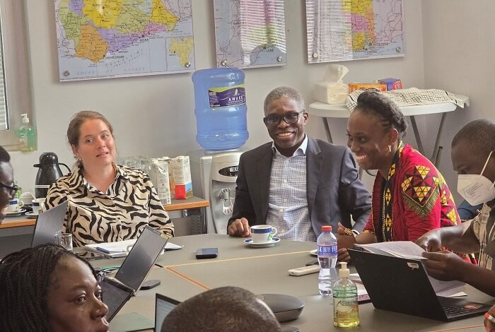 Ms Janine Walz and Dr Gameli Kewuribe Hoedoafia (middle) with other dignitaries in the meeting
