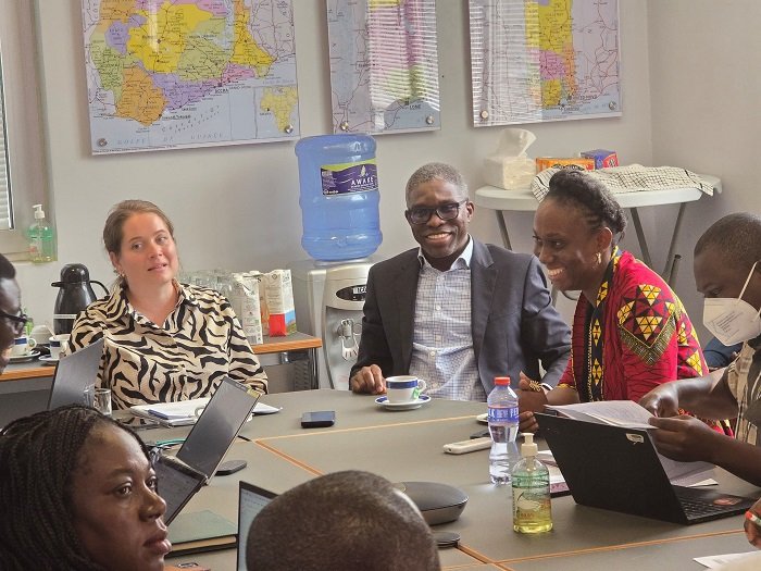 Ms Janine Walz and Dr Gameli Kewuribe Hoedoafia (middle) with other dignitaries in the meeting