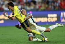 Joao Felix ( front) in a tussle for the ball with Al Ittihad's Fabinho