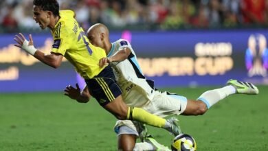 Joao Felix ( front) in a tussle for the ball with Al Ittihad's Fabinho