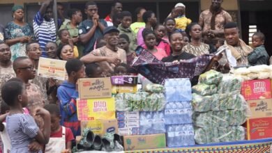 • Mr Mwinyelle handing over trhe items to Mrs Mable Amposah