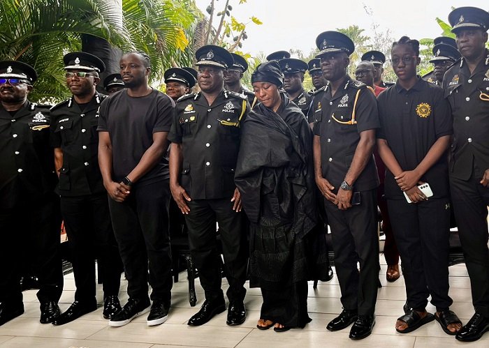 • COP Christian Tetteh Yohunu (fourth from left) with the widow, Priscilla Ofori-Atta (fourth from right) and other family and POMAB members after the visit
