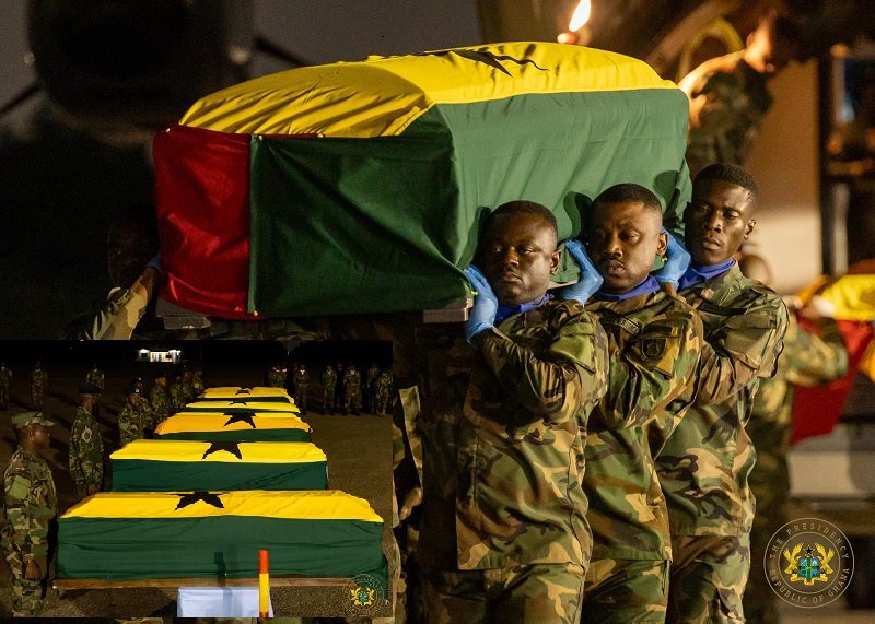 • Military personnel carrying one of the victims at the Airforce base, Burma camp