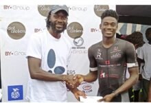 • Mr Amoako Boafo (left) presenting the winners prize to Sesi