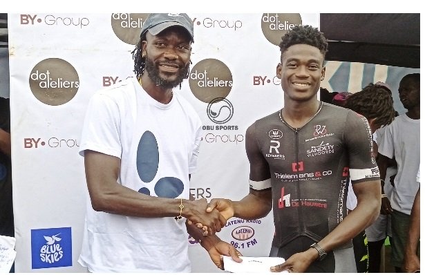 • Mr Amoako Boafo (left) presenting the winners prize to Sesi