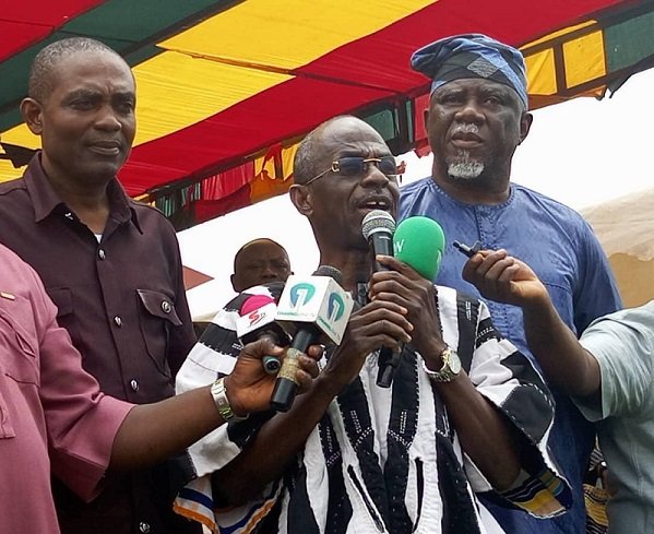 • Mr Asiedu Nketia (Inset) addressing the public at the funeral grounds