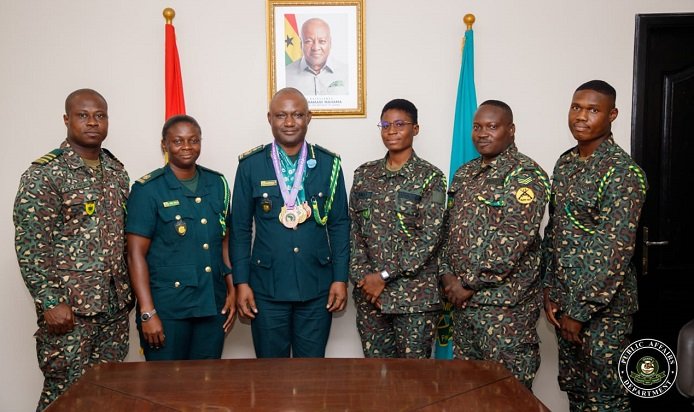 • Mr Basintale Amadu (third left) flanked to his right by Head of Sports at GIS, Superintendent Anita Wiredu-Minta and the pullers