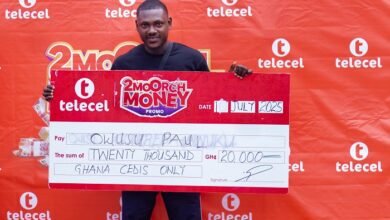 • Mr Owusu displaying his cheque