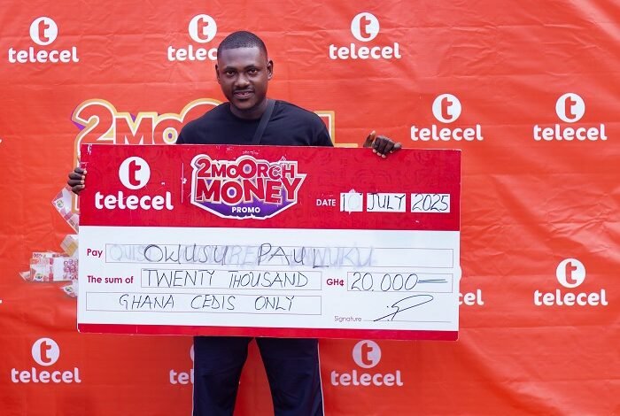 • Mr Owusu displaying his cheque