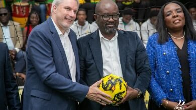 • Mr Simeon-Okraku flanked by Mr Blewett (left) and Mrs Asamoah after the signing