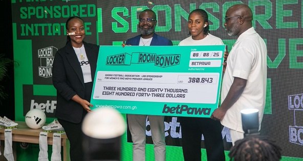 • Ms Ndanyungu (left) with Mr Harrison Addo (right) and other dignitaries after the signing