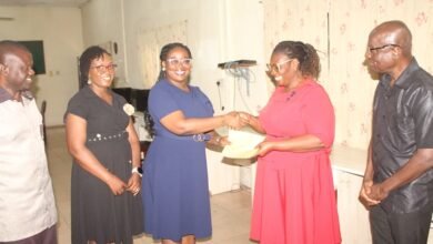 • Mrs Esther Ofori-Addo (second from right) receiving the cheque from Ms Esther Kumi. Present were both NIB and NTC staff
