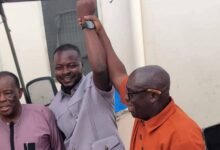 Mr David Sitsofe Tamakloe (middle) being declared winner by Mr Samuel D. Kwaah