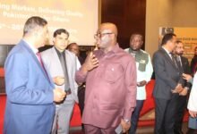 • Mr Eric Opoku (middle) interacting with Pakistan officials at the rice show programme. Photo. Ebo Gorman