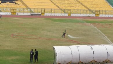 • Personnel of the GNFS watering the Baba Yara Stadium pitch