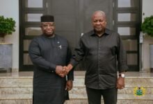 • President John Mahama (right) being consoled by President Julius Maada Bio