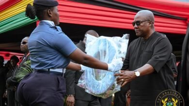President Mahama receiving a wreath to be laid in memory for the departed souls at the military cemetary