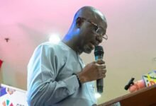 Mr Ziblim (inset) addressing the gathering