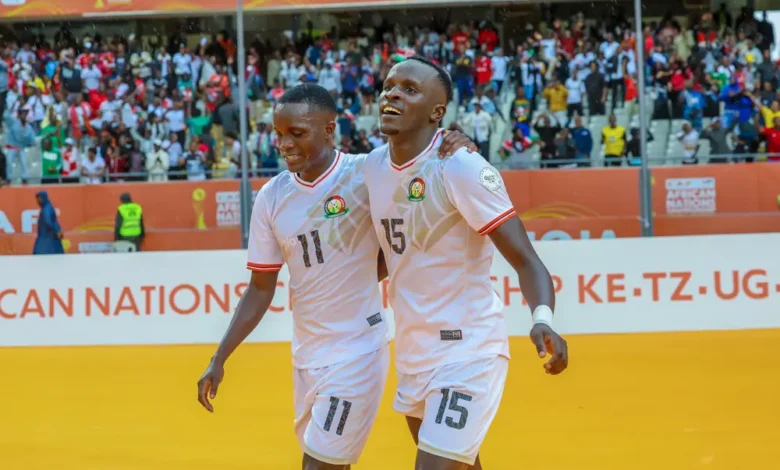 Ryan Ogam (15) with a team mate after his goal