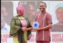 Mr Vanderpuye (right) receiving his award from Ms Gomashie